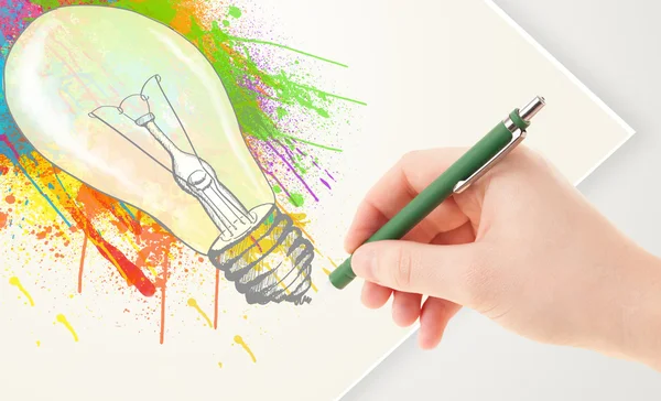 Hand drawing colorful idea light bulb with a pen — Stock Photo, Image