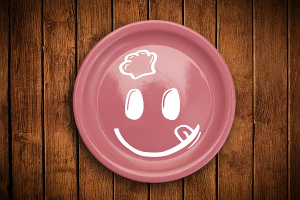 Happy smiley visage de dessin animé sur plaque de plat coloré — Photo