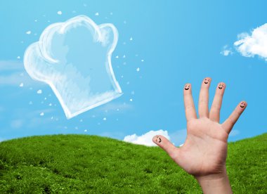 Mutlu gülen yüzlü parmaklar aşçı şapkasının resmine bakıyor.