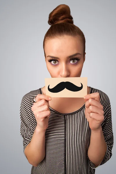 Menina bonito feliz segurando papel com desenho de bigode — Fotografia de Stock