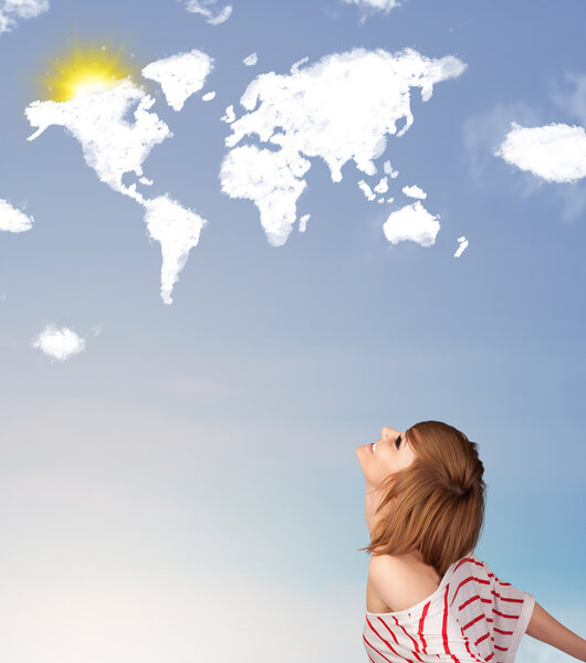 Young girl looking at world clouds and sun on blue sky