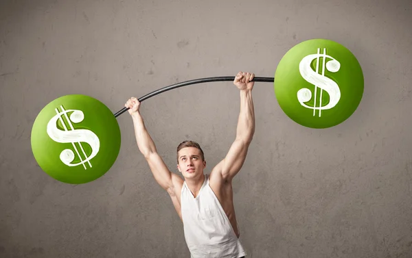 Muscular man lifting green dollar sign weights — Stock Photo, Image