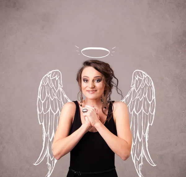 Cute girl z aniołem ilustrowane skrzydła — Zdjęcie stockowe