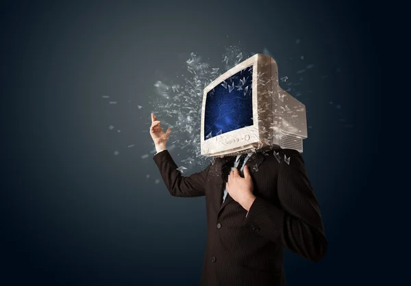 Computer monitor screen exploding on a young persons head — Stock Photo, Image