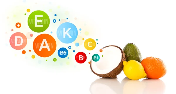 Healthy fruits with colorful vitamin symbols and icons — Stock Photo, Image