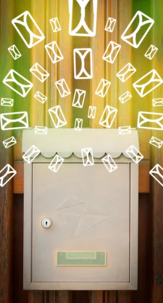 Mailbox with letter icons on glowing green background — Stock Photo, Image