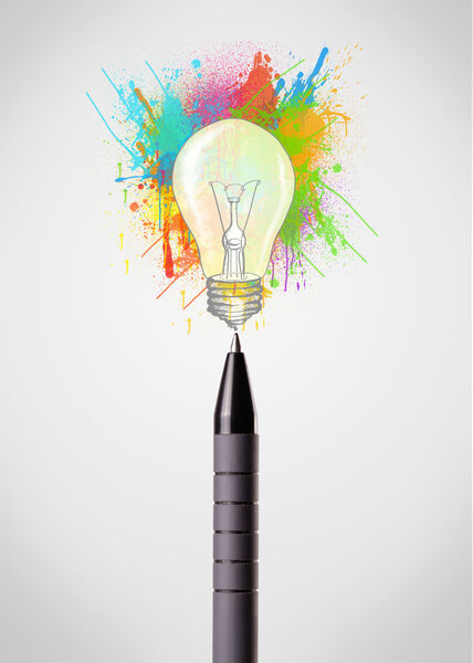 Pen close-up with colored paint splashes and lightbulb