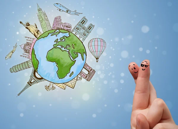 Cheerful finger smileys with famous landmarks of the globe — Stock Photo, Image