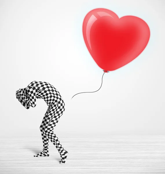 Mignon gars en costume morpsuit corps regardant un ballon en forme de coeur — Photo