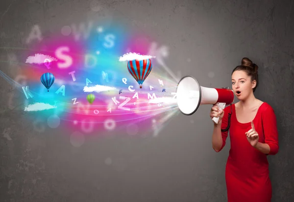 Girl shouting into megaphone and abstract text and balloons come — Stock Photo, Image