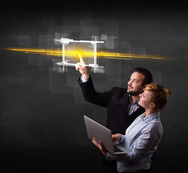 Pasangan bisnis teknologi muda menyentuh tombol dengan cahaya oranye Bea — Stok Foto