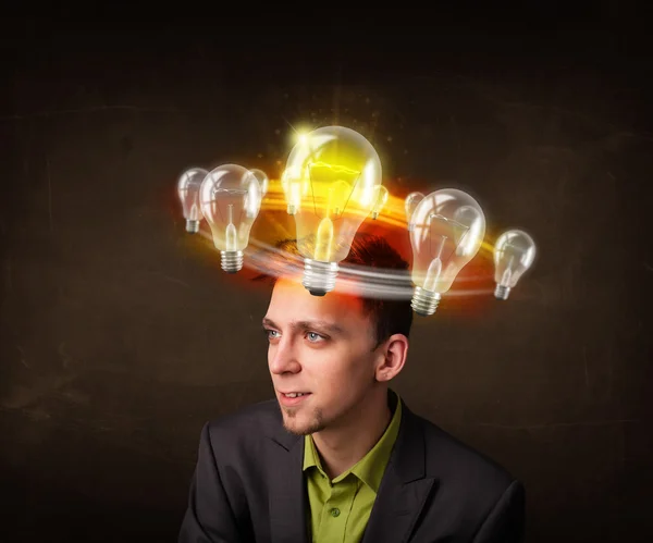 Man with light bulbs circlearing around his head — стоковое фото
