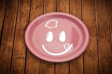 Renkli tabak üzerinde mutlu bir çizgi film yüzü