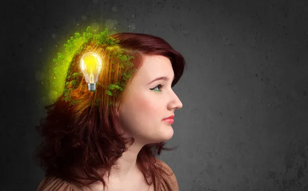 Young mind thinking of green eco energy with lightbulb — Stock Photo, Image