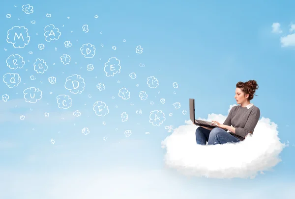 Young woman sitting in cloud with laptop — Stock Photo, Image