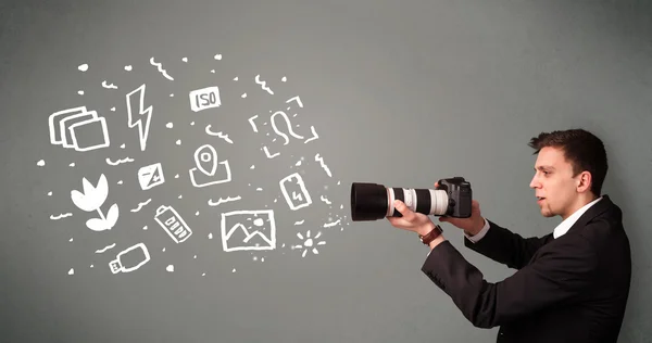 Photographer boy capturing white photography icons and symbols — Stock Photo, Image