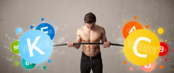 स्नायू माणूस रंगीत व्हिटॅमिन वजन उचलणे — स्टॉक फोटो, इमेज