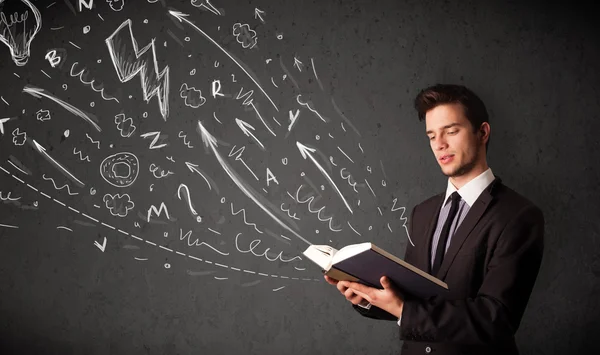 Young man reading a book — Stock Photo, Image