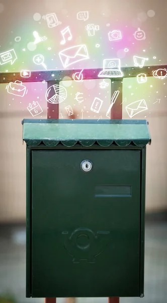 Colorful icons and symbols bursting out of a mailbox — Stock Photo, Image