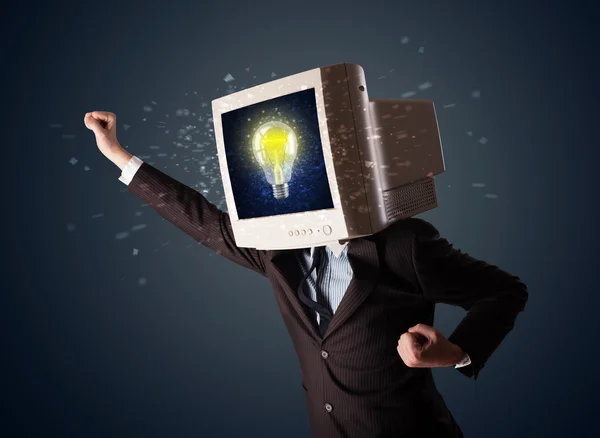 Business man with a pc monitor head and idea light bulb in the d — Stock Photo, Image