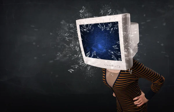 Computer monitor screen exploding on a young persons head — Stock Photo, Image