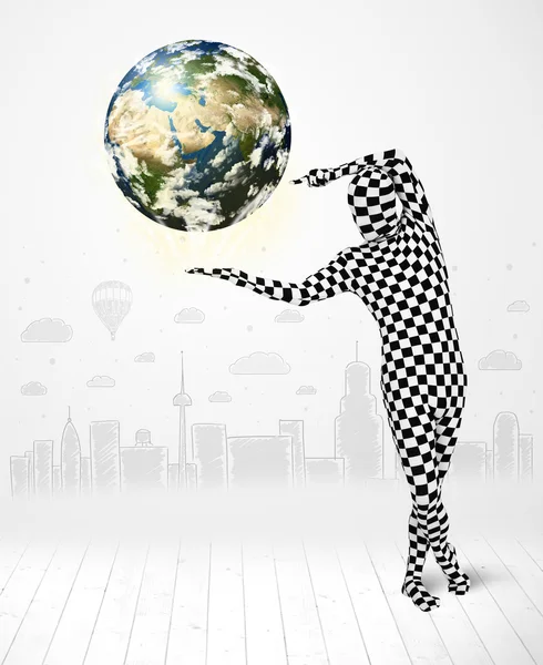 man in full body suit holding planet earth