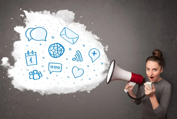 Woman shouting into loudspeaker and modern blue icons and symbol — Stock Photo, Image