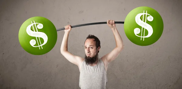 Skinny guy lifting green dollar sign weights — Stock Photo, Image