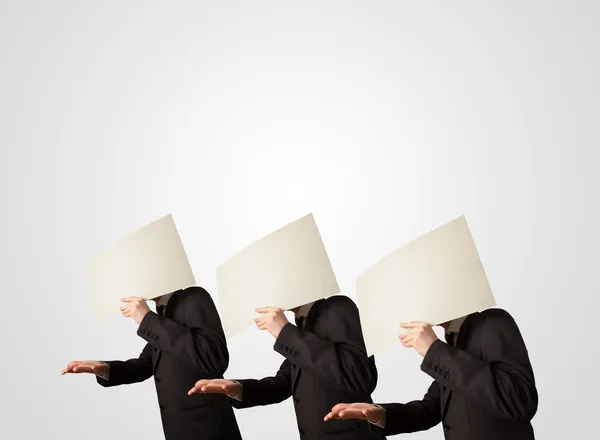 Men in formal gesturing with empty paper — Stock Photo, Image