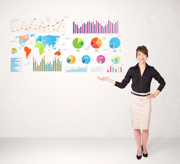 Business woman with colorful graphs and charts — Stock Photo, Image