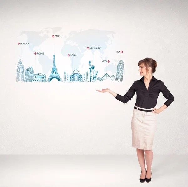 Business woman presenting map with famous cities and landmarks — Stock Photo, Image