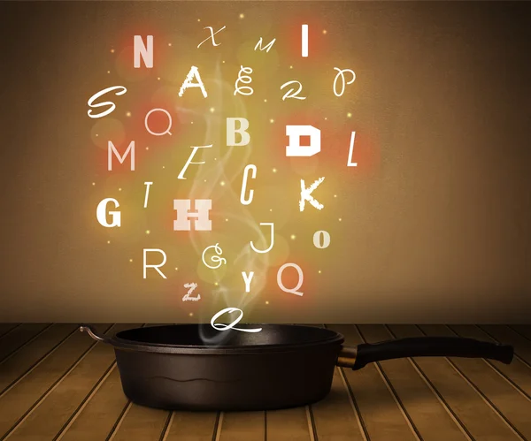 Светящиеся буквы, исходящие из котла — стоковое фото