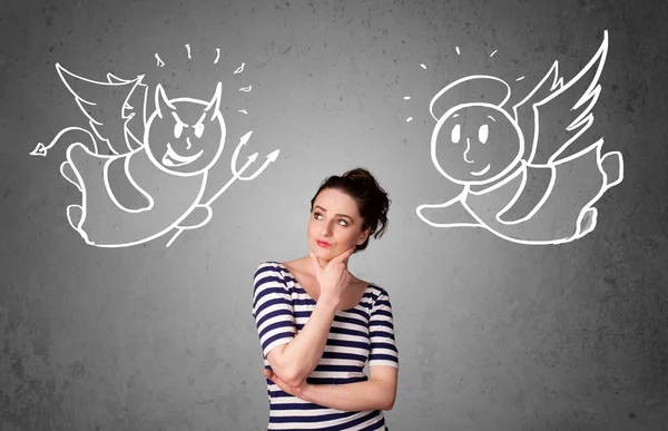 Woman standing between the angel and the devil — Stock Photo, Image