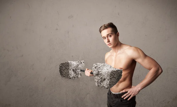 Muscular man lifting large rock stone weights — Stock Photo, Image