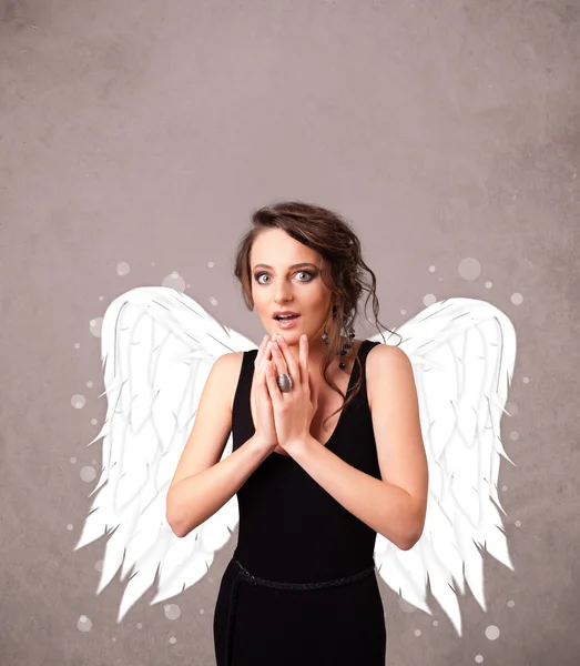 Cute girl with angel illustrated wings — Stock Photo, Image