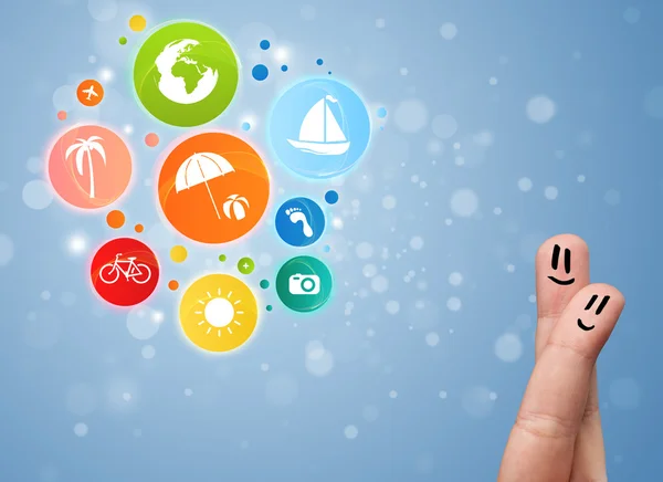 Cheerful finger smileys with colorful holiday travel bubble icon — Stock Photo, Image