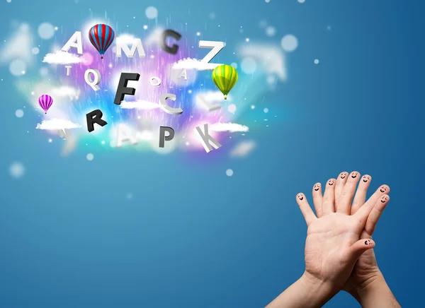 Happy smiley fingers looking at colorful magical clouds and ball — Stock Photo, Image