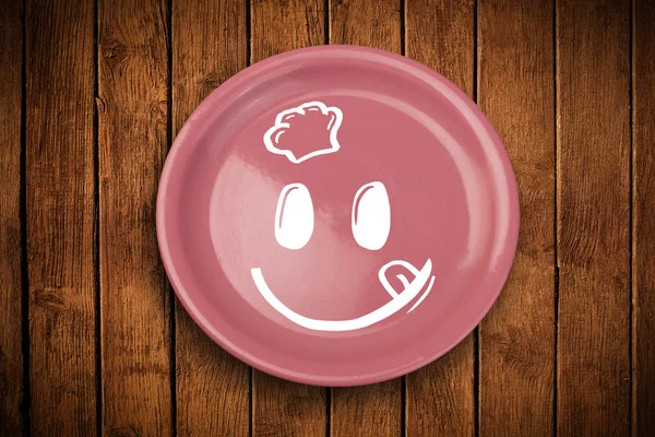 Szczęśliwy uśmiech kreskówki twarz na kolorowym talerzu — Zdjęcie stockowe