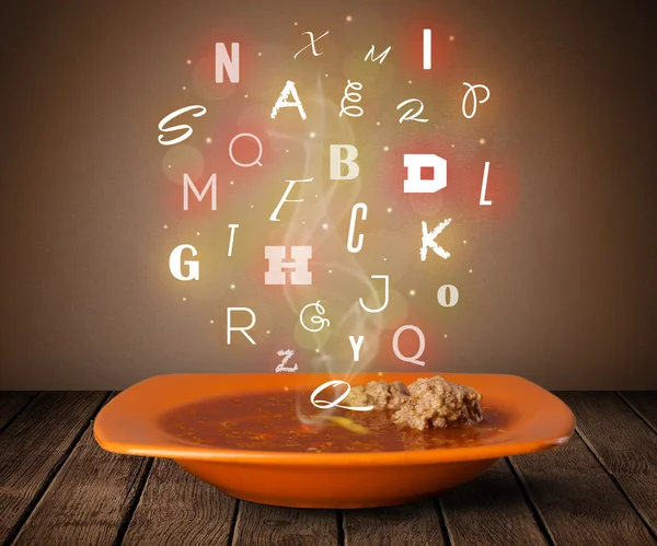 Colorful letters coming out of home cook soup bowl — Stock Photo, Image