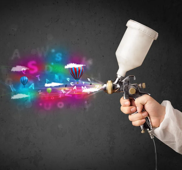 Worker with airbrush and colorful abstract clouds and balloons — Stock Image Worker with airbrush and colorful abstract clouds and balloons Stock Picture