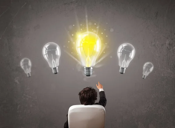 Business person having an idea light bulb concept — Stock Photo, Image