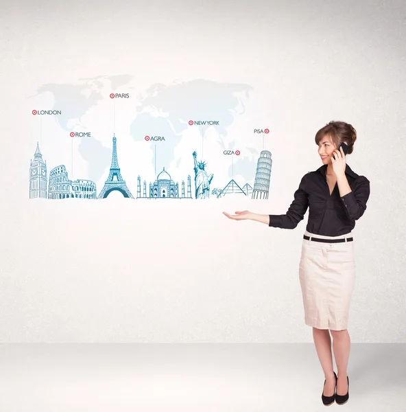 Business woman presenting map with famous cities and landmarks — Stock Photo, Image