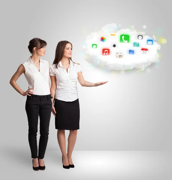 Young woman presenting cloud with colorful app icons and symbols — Stock Photo, Image