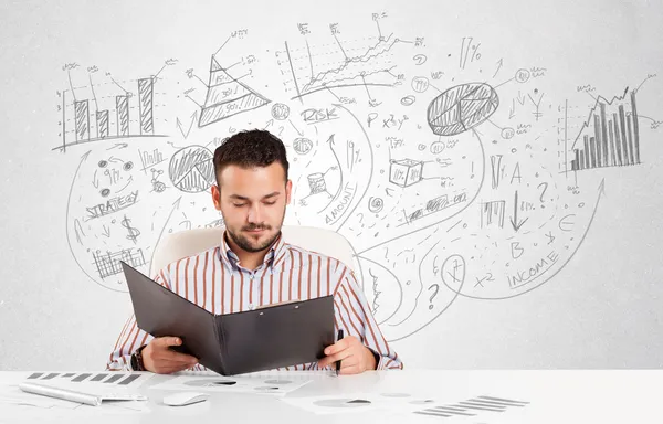 Business man at desk with hand drawn charts — Stock Photo, Image