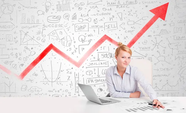 Zakelijke vrouw zit aan tafel met marktdiagrammen — Stockfoto