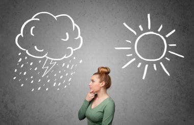 bir güneş ve yağmur çizme arasında duran kadın