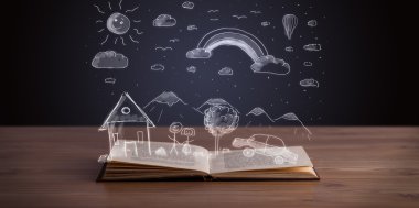 Elle çizilmiş peyzaj ile açık kitap