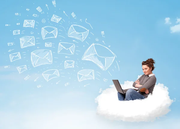 Young woman sitting in cloud with laptop — Stock Photo, Image