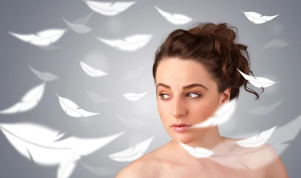 Beautifull young girl with light feather skin concept — Stock Photo, Image