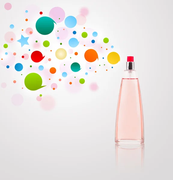 Perfume bottle spraying colored bubbles — Stock Photo, Image